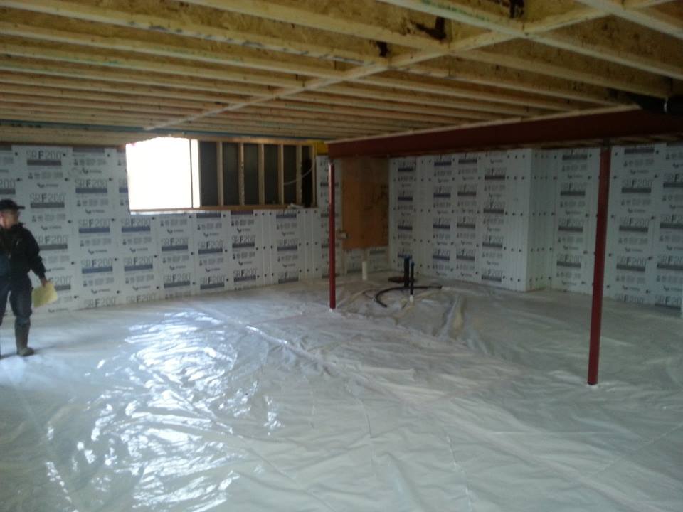 under construction home basement with white plastic on floor